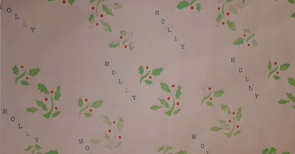Hand-stamped Christmas wrapping paper with holly print